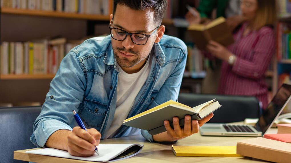 Man studying in a library
