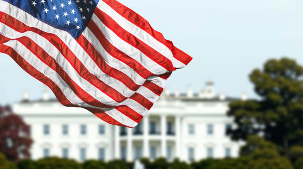 American flag in front of the White House