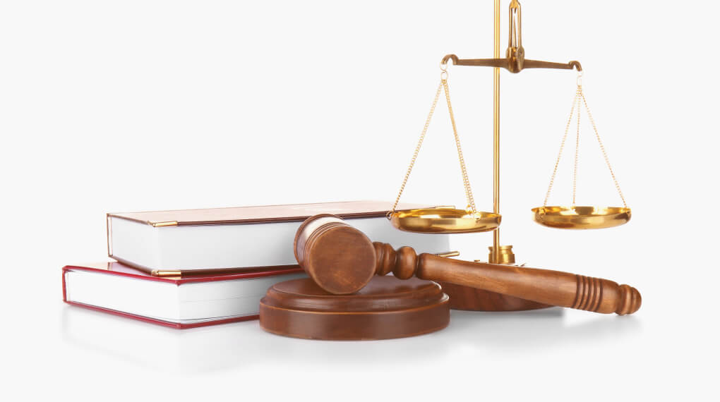 Books, a gavel, and the Scales of Justice